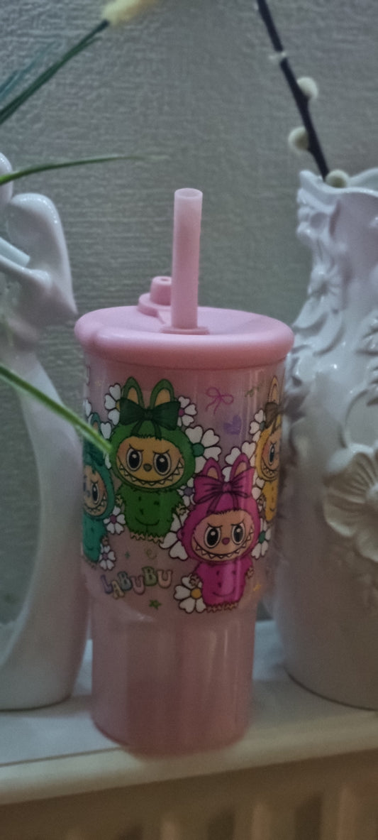 Pink cup with a large straw suitable for milkshakes and iced coffees.