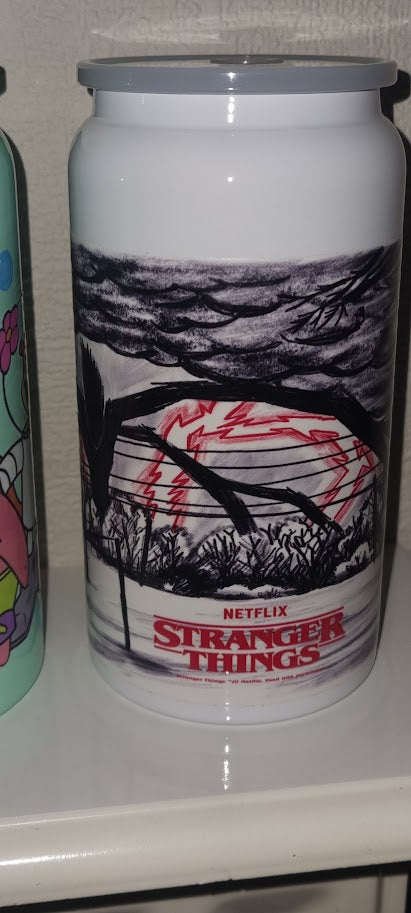 Can with 'Stranger Things' design on a white surface